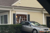 No Injuries When Car Backs Into Home